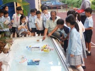Students were testing the floating performance of their boats.